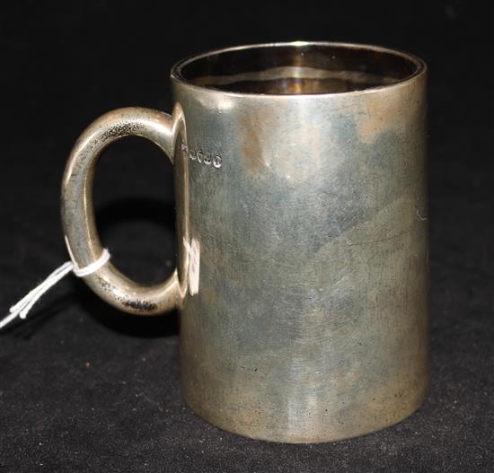 A Victorian silver mug with glazed base, by Daniel & Charles Houle, London, 1870.